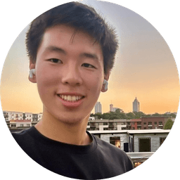 Picture of Ganning Xu in front of an orange sunset