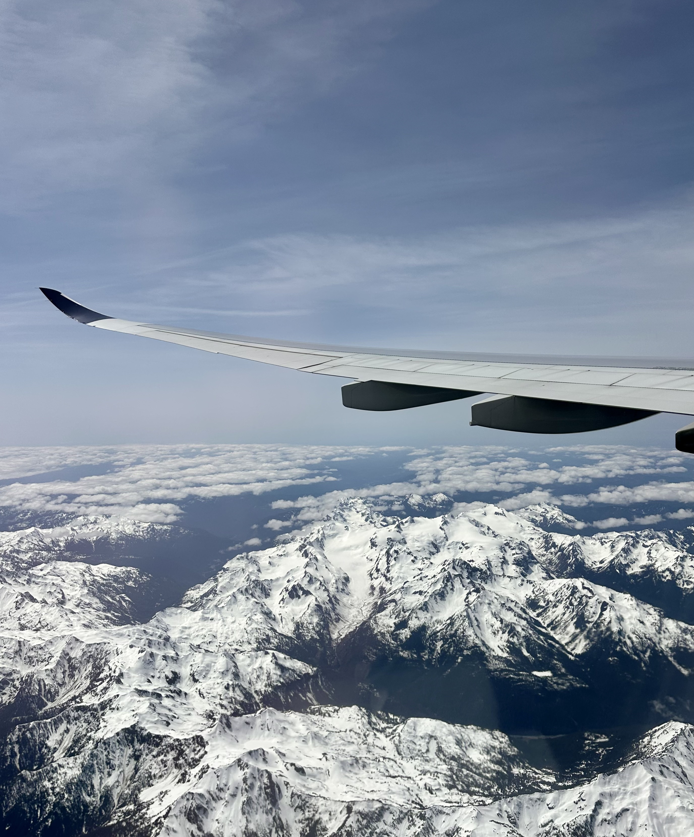 Delta A330-900 flying over the mountains after taking off from Seattle-Tacoma International Airport